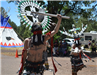 People in Traditional Native American Attire Dancing