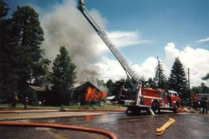 Fire Engine and Firefighters at the Scene of a Fire
