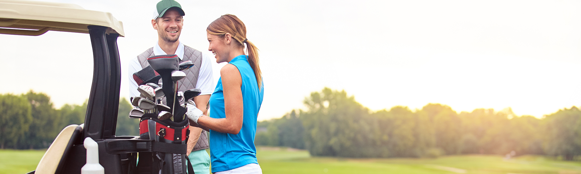 Man and Woman Talking Together on the Golf Course