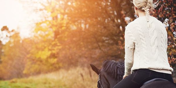 Woman on Horseback in Nature
