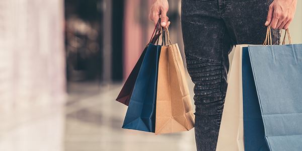 Person Holding Several Shopping Bags